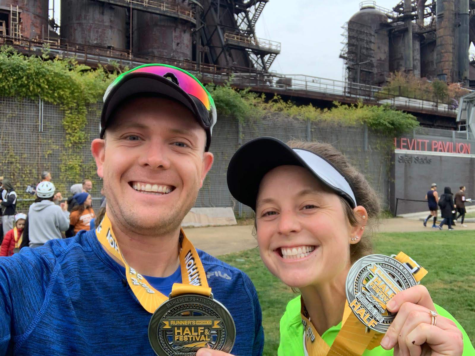 Chelsea and her husband holding their medals